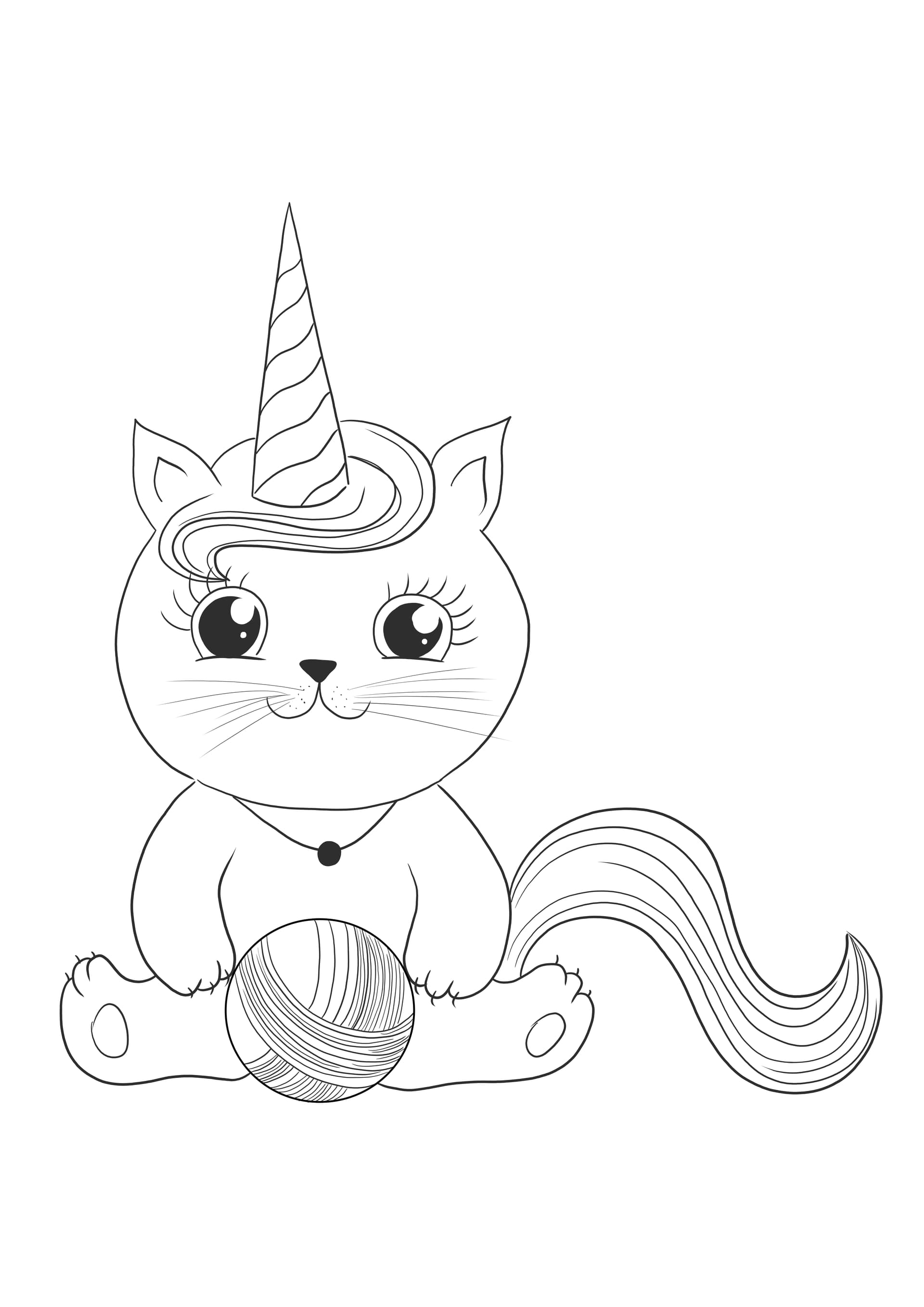 Unicorn cat playing with a thread ball
